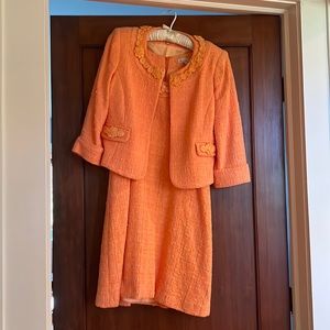 Serena Kay tangerine suit, size 44. Fits and looks new. Worn 3 times.